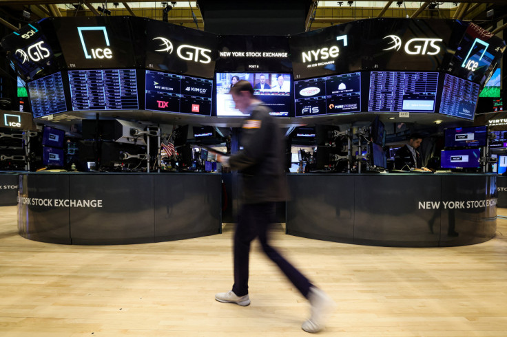 Traders work on the floor of the NYSE in New York