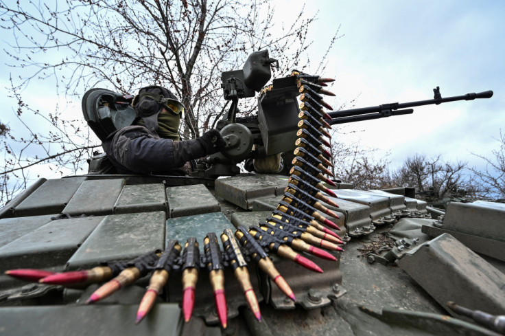 Ukrainian serviceman checks a machine gun of a tank after loading an ammunition during a military training near a frontline in Zaporizhzhia region