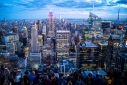 People enjoy the Manhattan skyline during sunset in New York