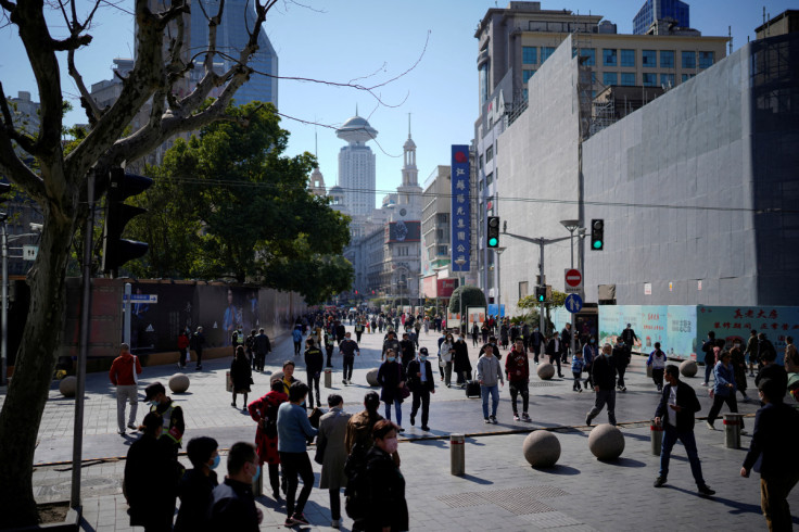 People walk at the main shopping area in Shanghai