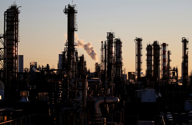 Smoke rises from a factory during the sunset at Keihin industrial zone in Kawasaki