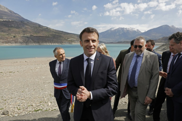 On the shores of western Europe's largest fresh-water reservoir, Macron sought to brush aside weeks of political turmoil