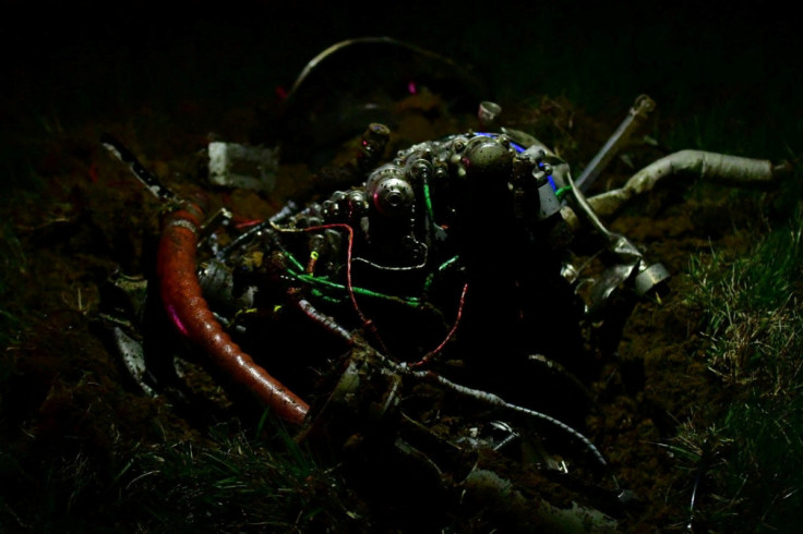 Debris from a helicopter crash is pictured at the crash site in Trigg County, Kentucky