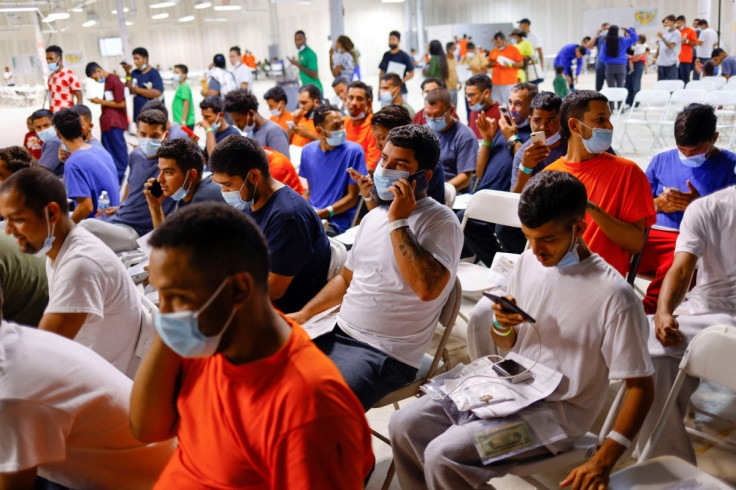 Migrants rest at the Migrant Welcome Center in El Paso, Texas