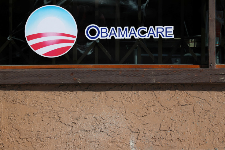 A sign on an insurance store advertises Obamacare in San Ysidro