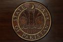 Logo of the State Bank of Pakistan (SBP) is pictured on a reception desk at the head office in Karachi