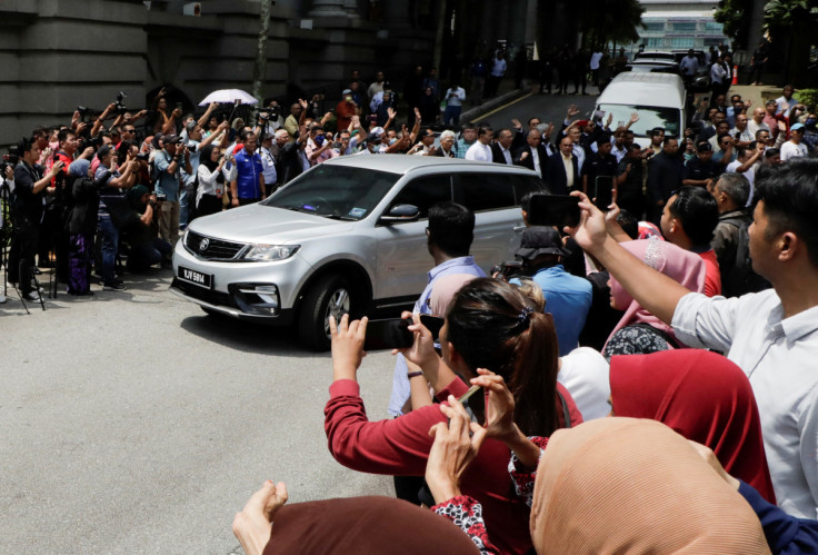 Former Malaysian Prime Minister Najib Razak leaves in a vehicle from Palace of Justice at Putrajaya