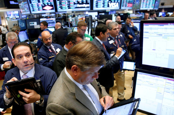 Traders work on the floor of the NYSE