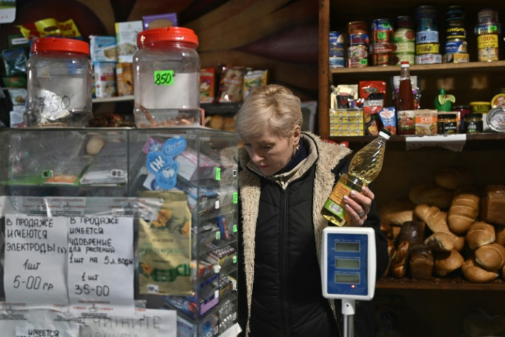 The shop on the corner of a muddy road is one of the few remaining open in the heavily shelled town of Chasiv Yar near the frontline in east Ukraine