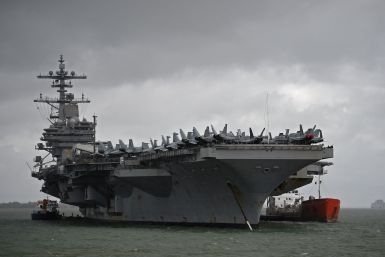 The USS George H.W. Bush aircraft carrier is seen anchored off Stokes Bay in the Solent