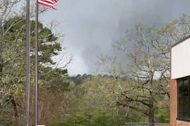 This framegrab from a video provided by Lane Hancock on March 31, 2023 shows a tornado brewing in Little Rock, Arkansas