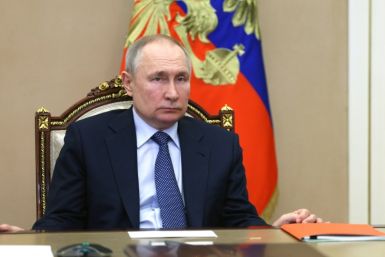 Russian President Vladimir Putin chairs a Security Council meeting via a video link