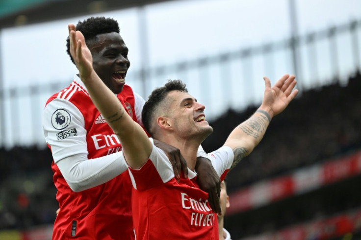 Top Guns: Arsenal won a seventh consecutive league game to remain eight points clear at the top