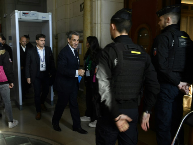 Former French president Nicolas Sarkozy arrives at a Paris courthouse for the appeal hearing of a corruption trial on December 15, 2022