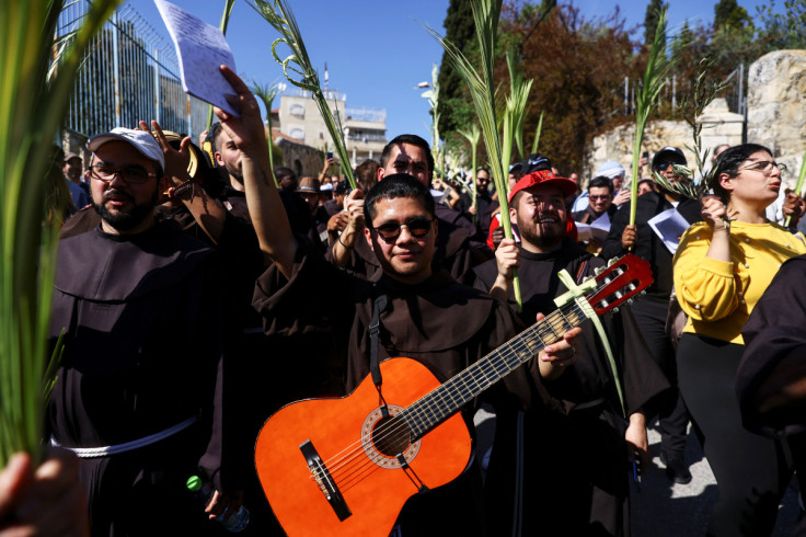 Christian worshippers attend a Palm Sunday procession on the Mount of Olives in Jerusalem