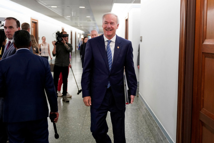 Arkansas Governor Asa Hutchinson walks through the Dirksen Senate office building in Washington
