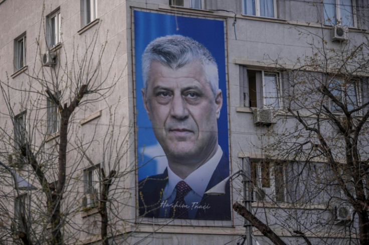 Former Kosovo president Hashim Thaci, seen here on a billboard in Pristina, denies charges of war crimes and crimes against humanity