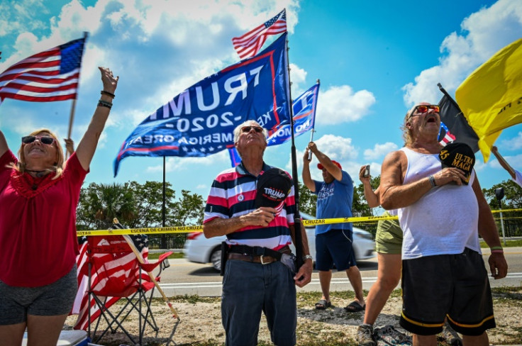 Supporters of Donald Trump gather near his Mar-a-Lago club in Palm Beach, Florida, as the former US president prepares to head to New York and face criminal charges