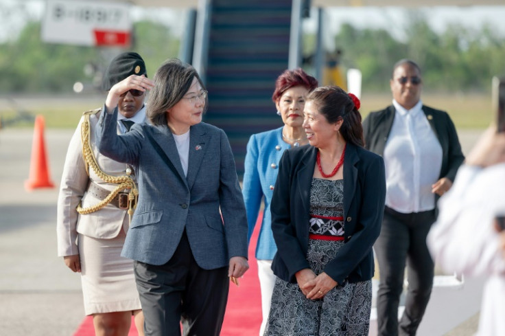 Taiwan President Tsai Ing-wen (L) talks with Belize Governor-General Froyla Tzalam upon arriving at the airport in Belmopan, Belize