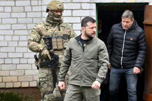 Ukrainian President Volodymyr Zelensky and German Vice Chancellor Robert Habeck (r) emerge from the basement of the school in Yagidne where villagers were kept for almost month by Russian troops
