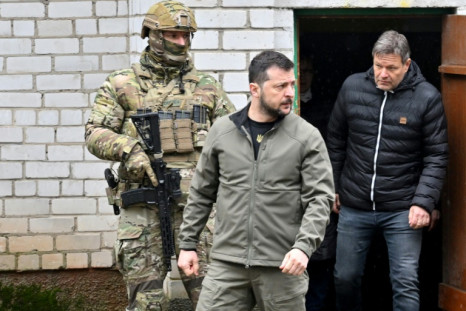 Ukrainian President Volodymyr Zelensky and German Vice Chancellor Robert Habeck (r) emerge from the basement of the school in Yagidne where villagers were kept for almost month by Russian troops