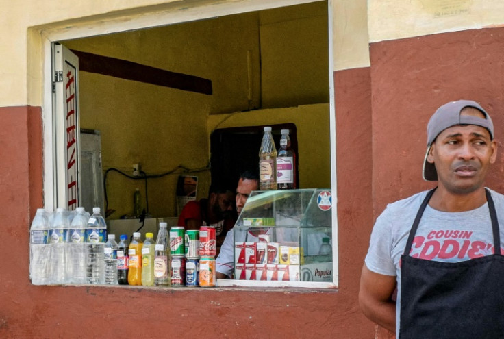 Cubans can extract dollars from the bank but in limited quantities, meaning that black market dealers can charge a premium