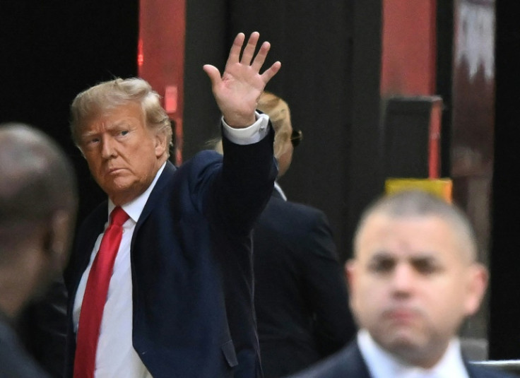 Trump waved to supporters as he arrived at his New York residence on the eve of the historic court hearing