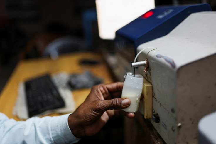 Milk is tested using an auto electronic milk tester at a milk collection centre on the outskirts of Jaipur