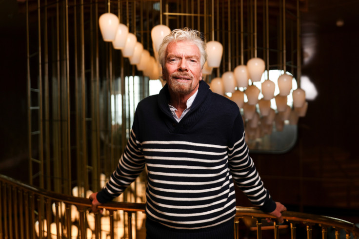 Richard Branson, founder of Virgin Group, poses for a photograph on board of his new cruise liner, the Scarlet Lady at Dover Port in Dover