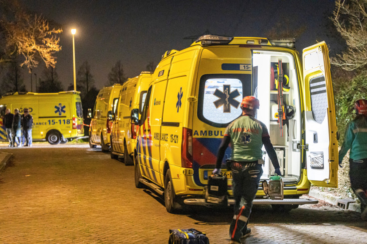 A general view shows rescue operations underway following the derailment of a passenger train after it hit construction equipment on the track, in Voorschoten