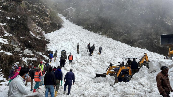 Rescue team members search for survivors after an avalanche in the northeastern state of Sikkim