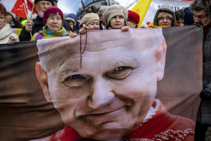 Supporters turned out in Warsaw on April 2 to defend the legacy of Polish-born Pope John Paul II on the 18th anniversary of his death