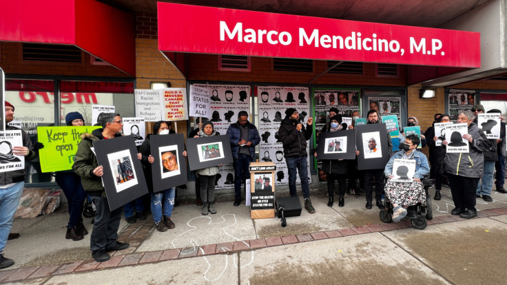 Protesters gather for Refugee Rights Day in front of Public Safety Minister Marco Mendicino's constituency in Toronto