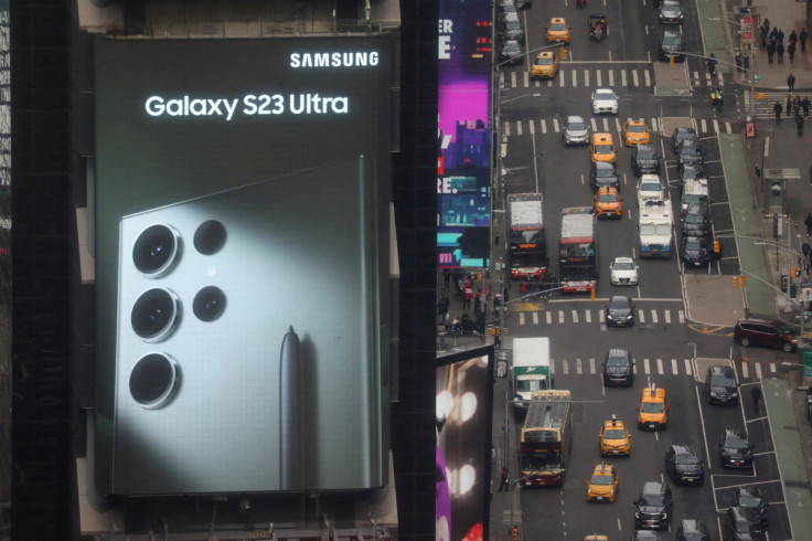 Traffic passes a Samsung Electronics Co digital billboard in the Times Square area of Manhattan