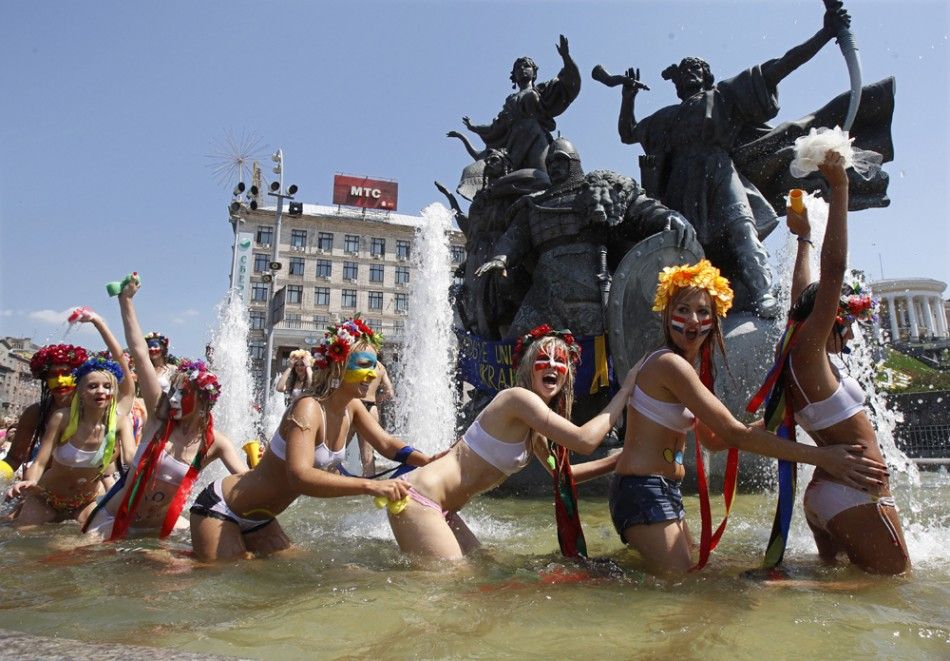 Activists from quotFemenquot stage a protest in a fountain