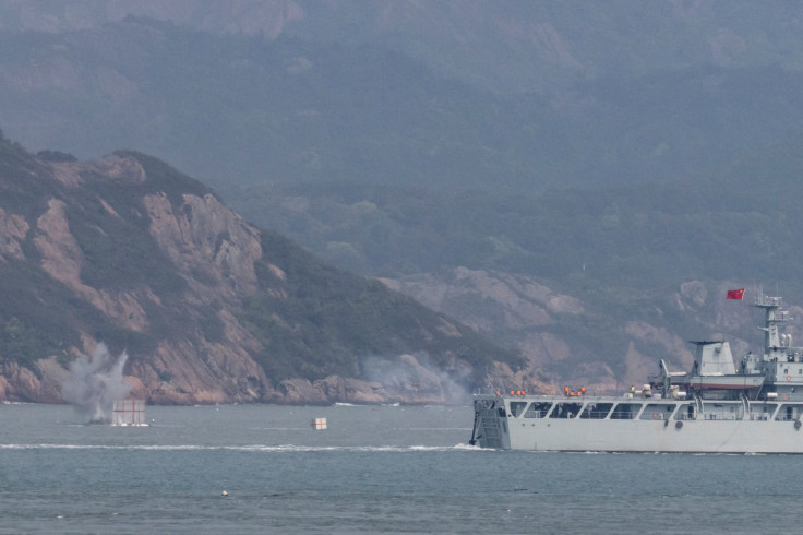 A Chinese warship fires towards the shore during a military drill near Fuzhou near the Taiwan controlled Matsu Islands