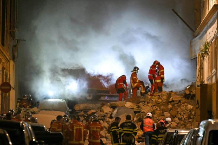 A fire was hampering the search for any possible victims under the rubble, the mayor said