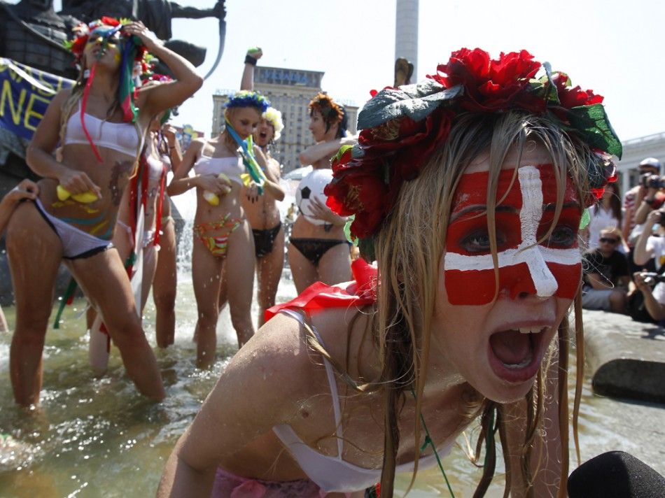 Femen activists protest in a bikini