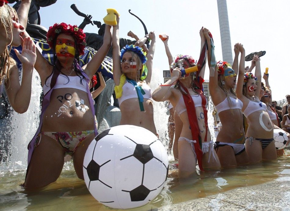 Girls in Bikini protest in a fountain in Kiev, Ukraine