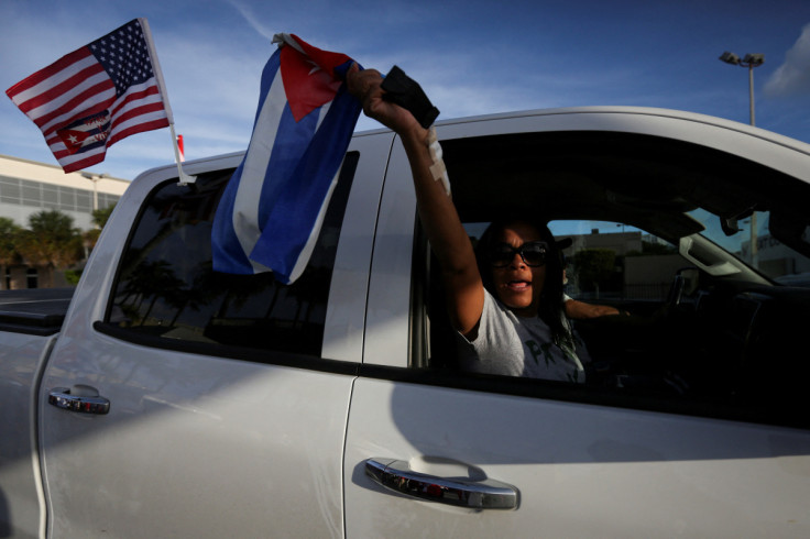 Emigres react to reports of protests in Cuba against its deteriorating economy, in Miami, Florida