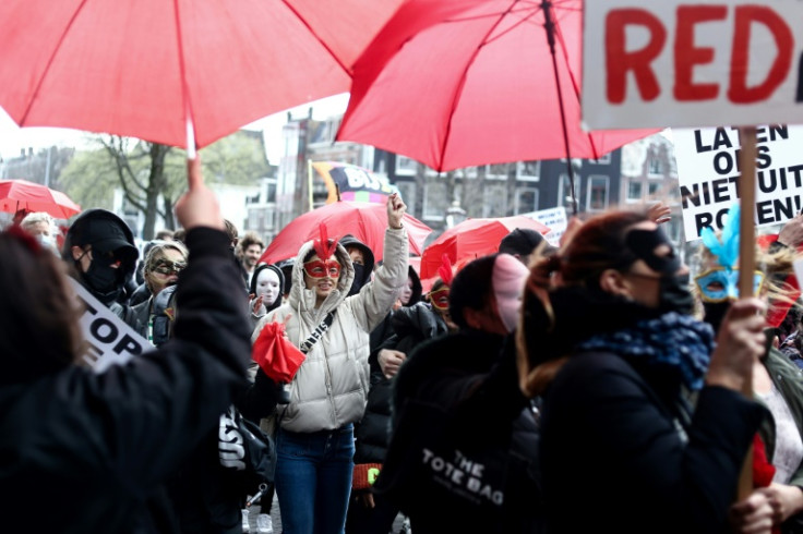 Sex workers have protested against plans to move them from Amsterdam's red light district to an 'erotic centre'