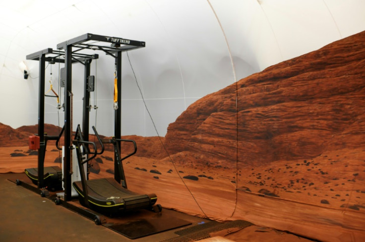 A treadmill and straps help replicate Mars' lesser gravity