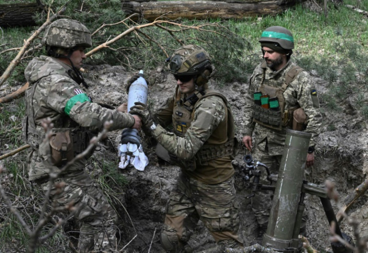 Ukrainian troops prepare to fire a 120 mm mortar toward Russian positions in the Donetsk region on April 5, 2023