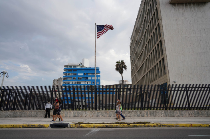 People pass by the U.S. Embassy in Havana