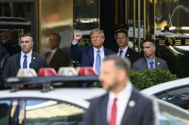 Former US president Donald Trump pumped his fist as he departed Trump Tower in New York on April 13, 2023