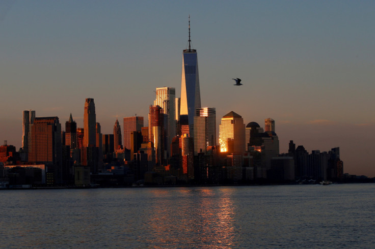 A view of the One World Trade Centre tower and the lower Manhattan skyline of New York City at sunrise as seen from Hoboken