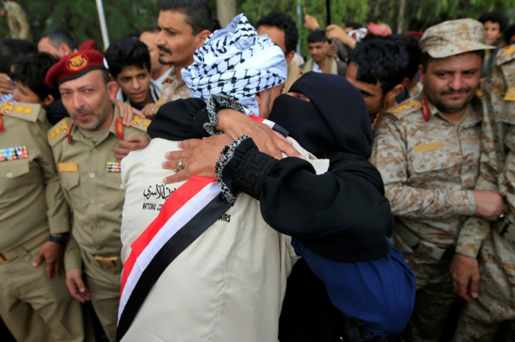 A large crowd welcomes home returning prisoners at the airport in Yemen's rebel-held capital Sanaa on Friday