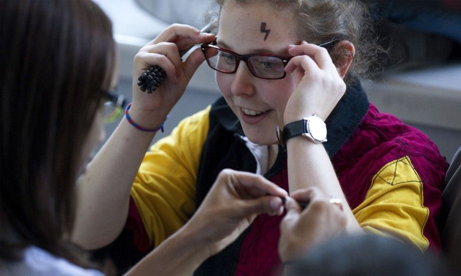 Harry Potter fans wait in line at a movie theater in New York