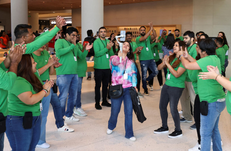 Apple employees welcome bloggers and journalists inside India's first Apple retail store, a day ahead of its launch in Mumbai