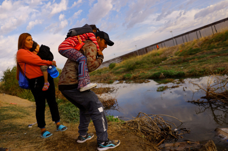 Migrants from Venezuela prepare to cross the Rio Bravo river, as seen from Ciudad Juarez